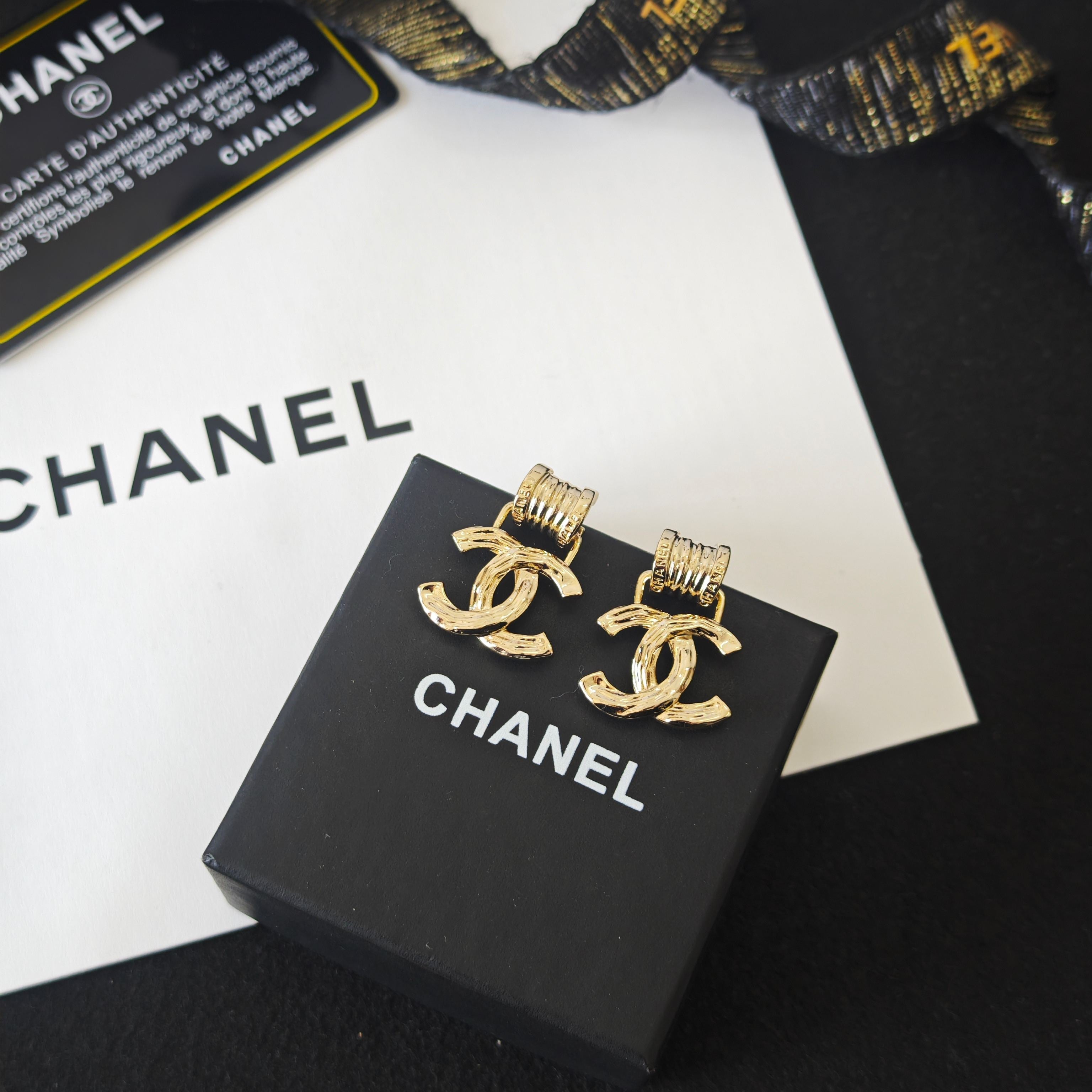 Intricately Carved Spring Letter Earrings