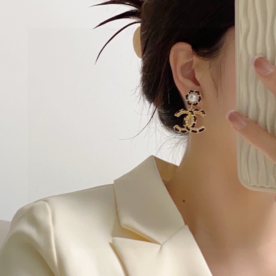 Black leather pearl earrings