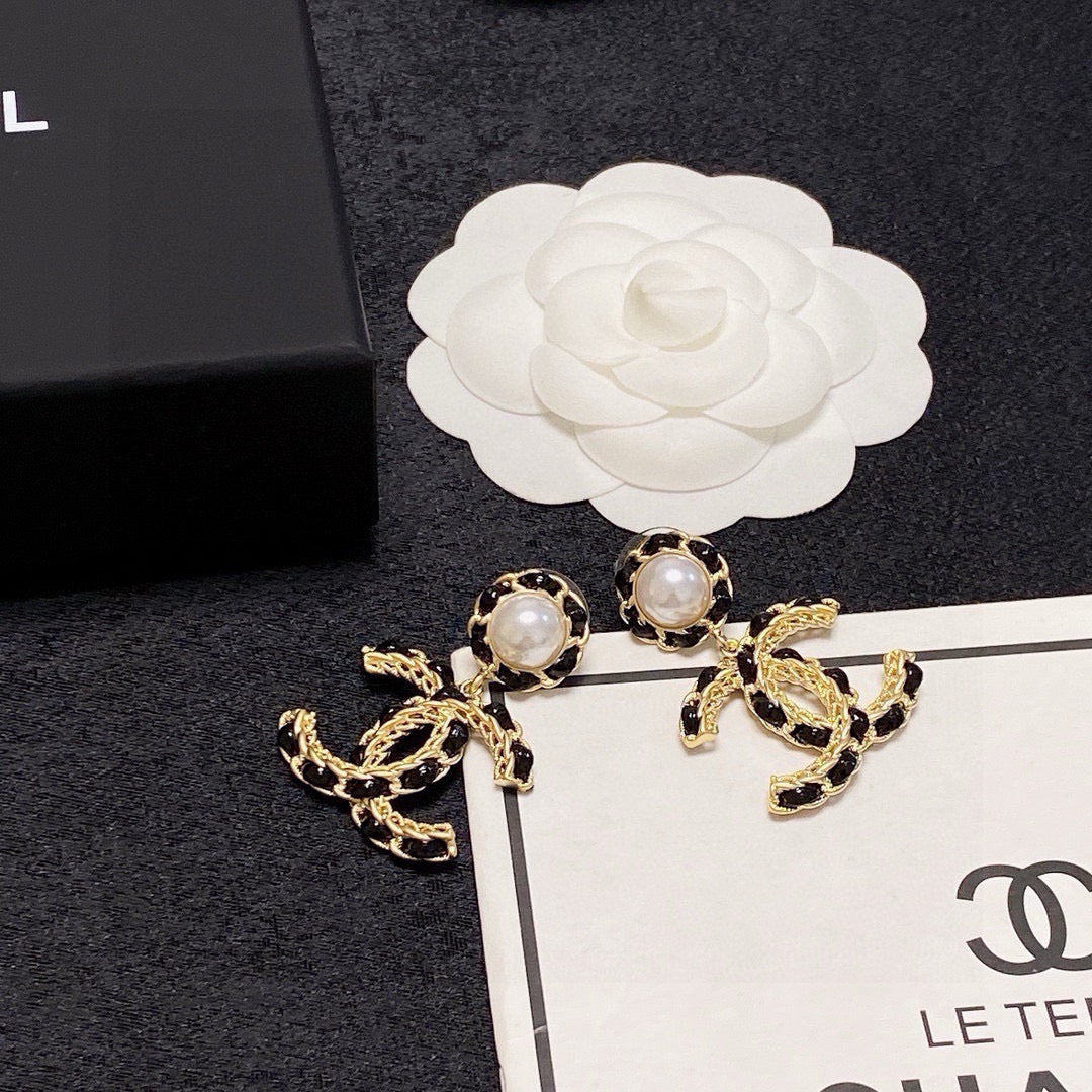 Black leather pearl earrings