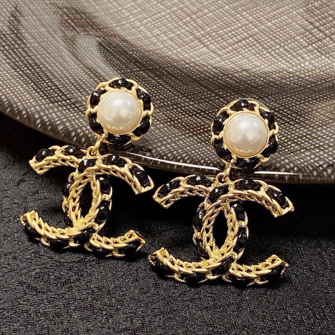 Black leather pearl earrings