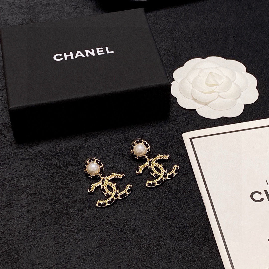 Black leather pearl earrings