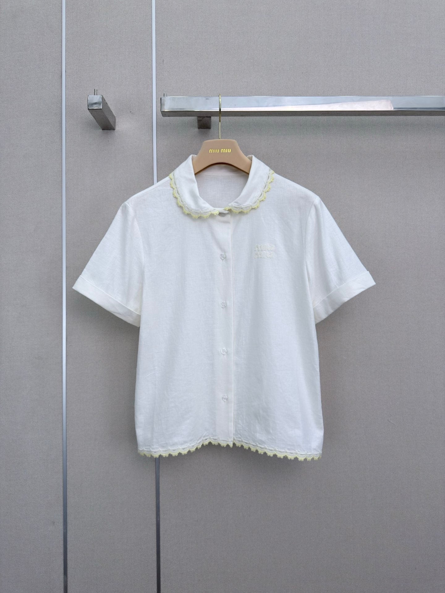 Lace-trimmed short white shirt