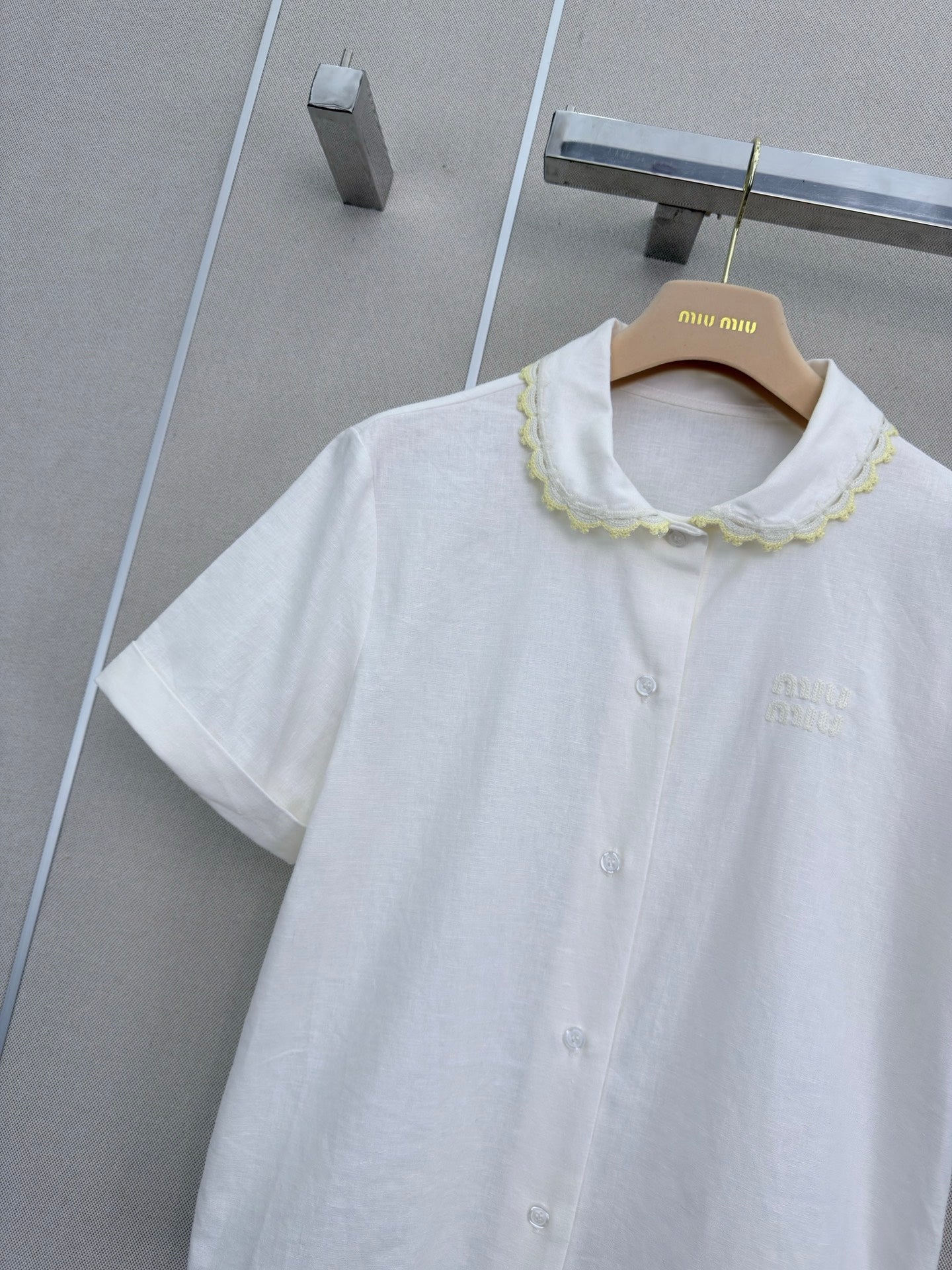 Lace-trimmed short white shirt