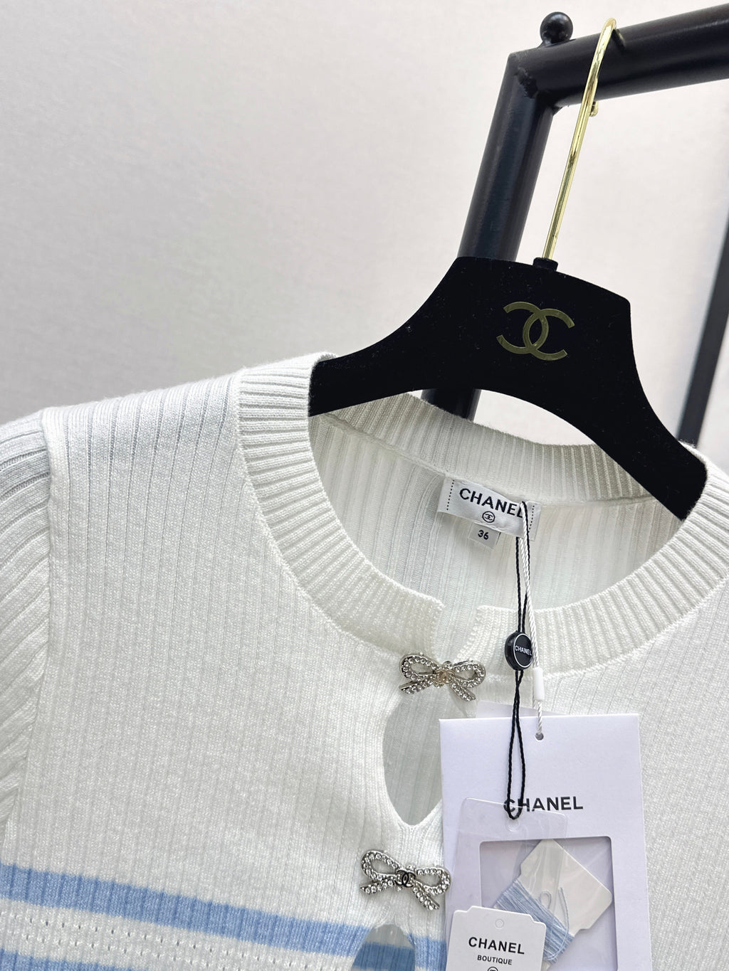 26SS - New striped knit top with bow embellishment