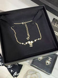 New white enamel bow necklace with diamonds and pearls