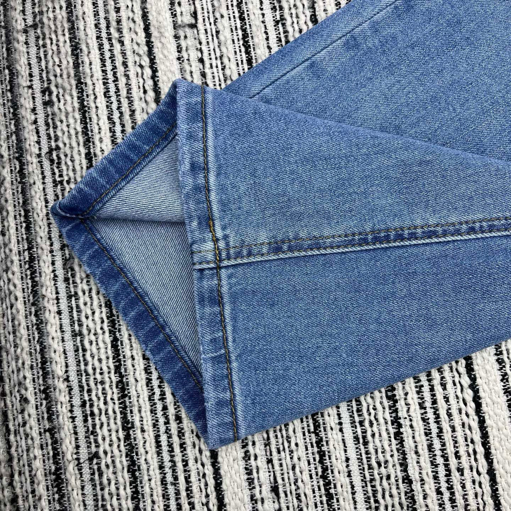 Spring 2026 Early Collection: New Straight-Leg Denim Jeans featuring Beaded Pockets, Embroidered Double-C Pocket Detail, and Washed Finish