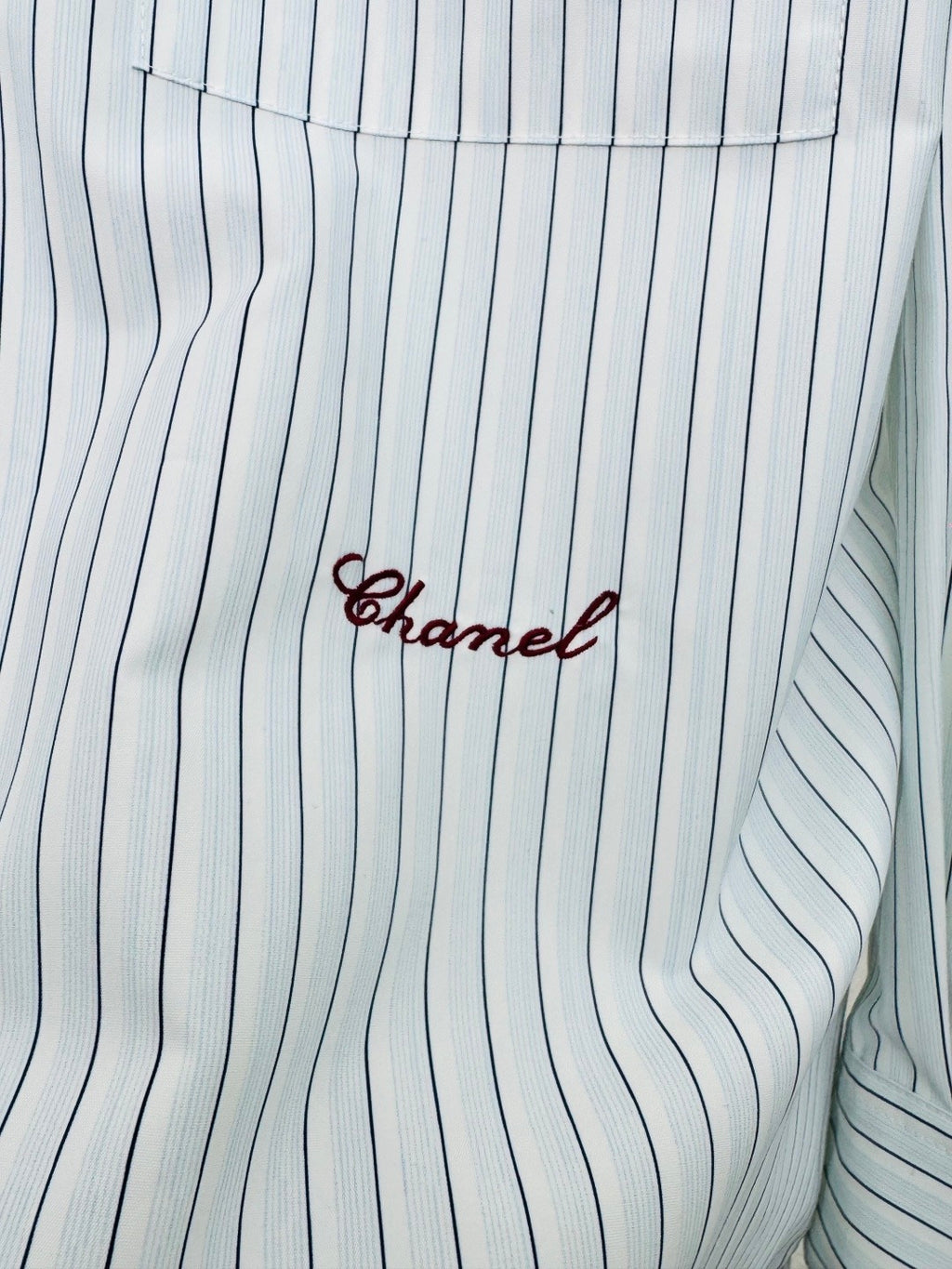 Striped shirt from the Spring/Summer 2026 collection, featuring a blue and white vertical stripe design, fresh and simple.