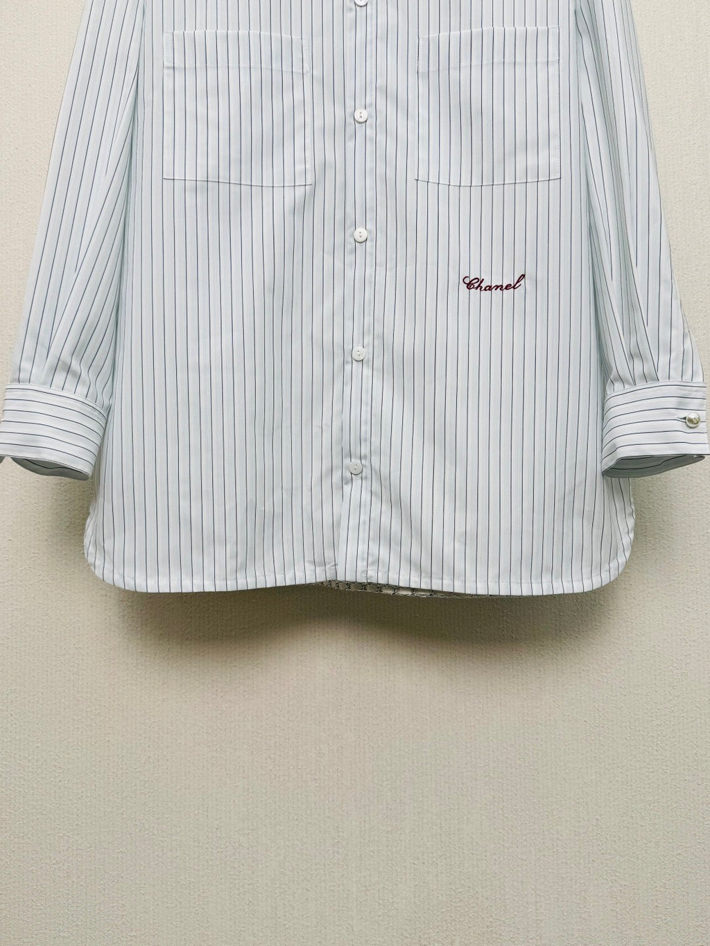 Striped shirt from the Spring/Summer 2026 collection, featuring a blue and white vertical stripe design, fresh and simple.