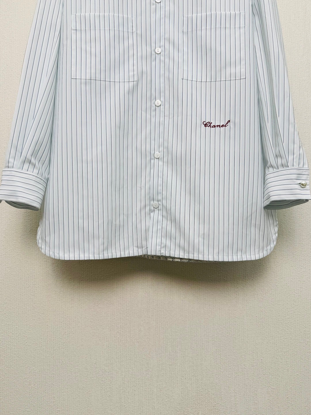 Striped shirt from the Spring/Summer 2026 collection, featuring a blue and white vertical stripe design, fresh and simple.