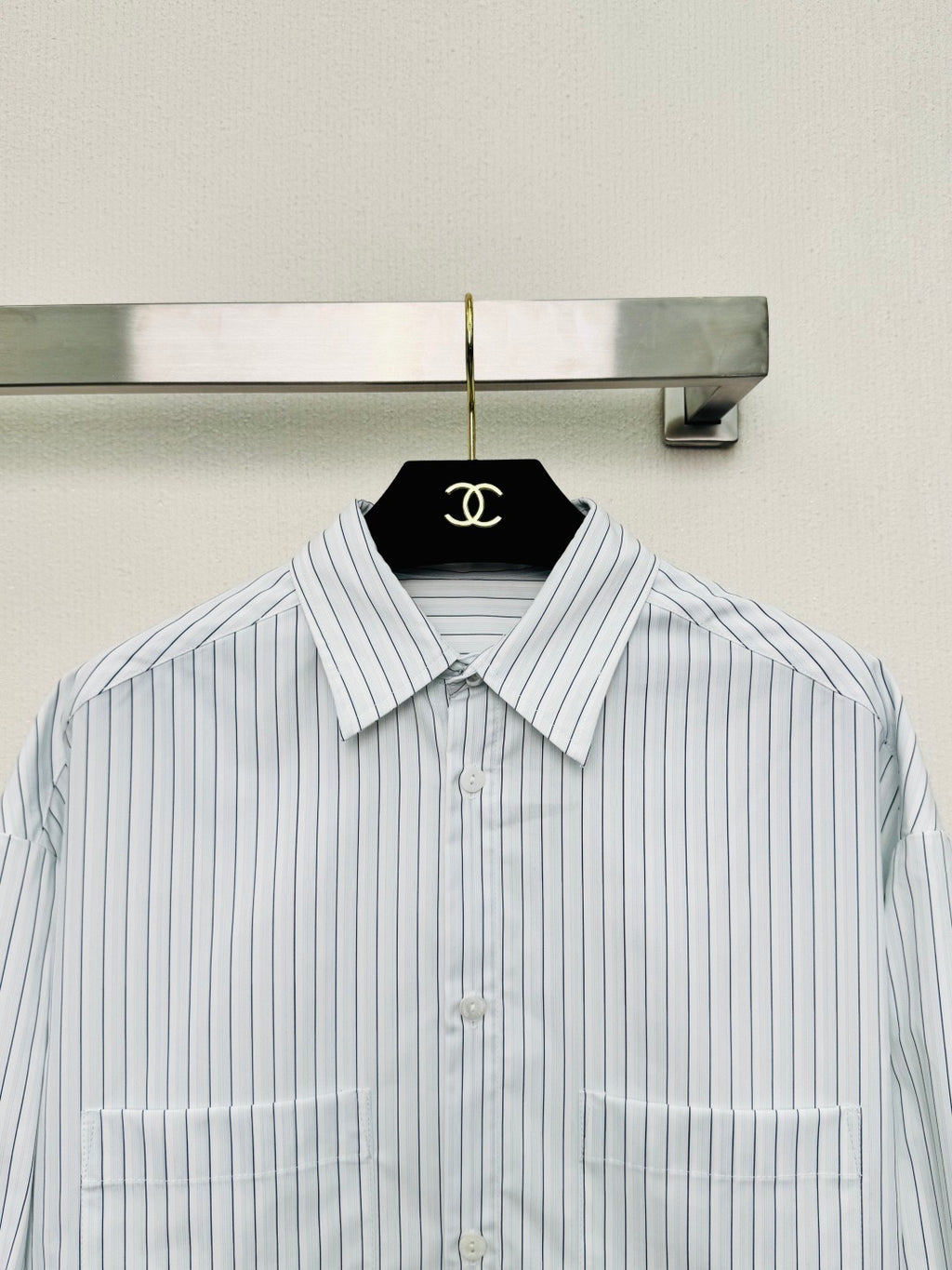 Striped shirt from the Spring/Summer 2026 collection, featuring a blue and white vertical stripe design, fresh and simple.