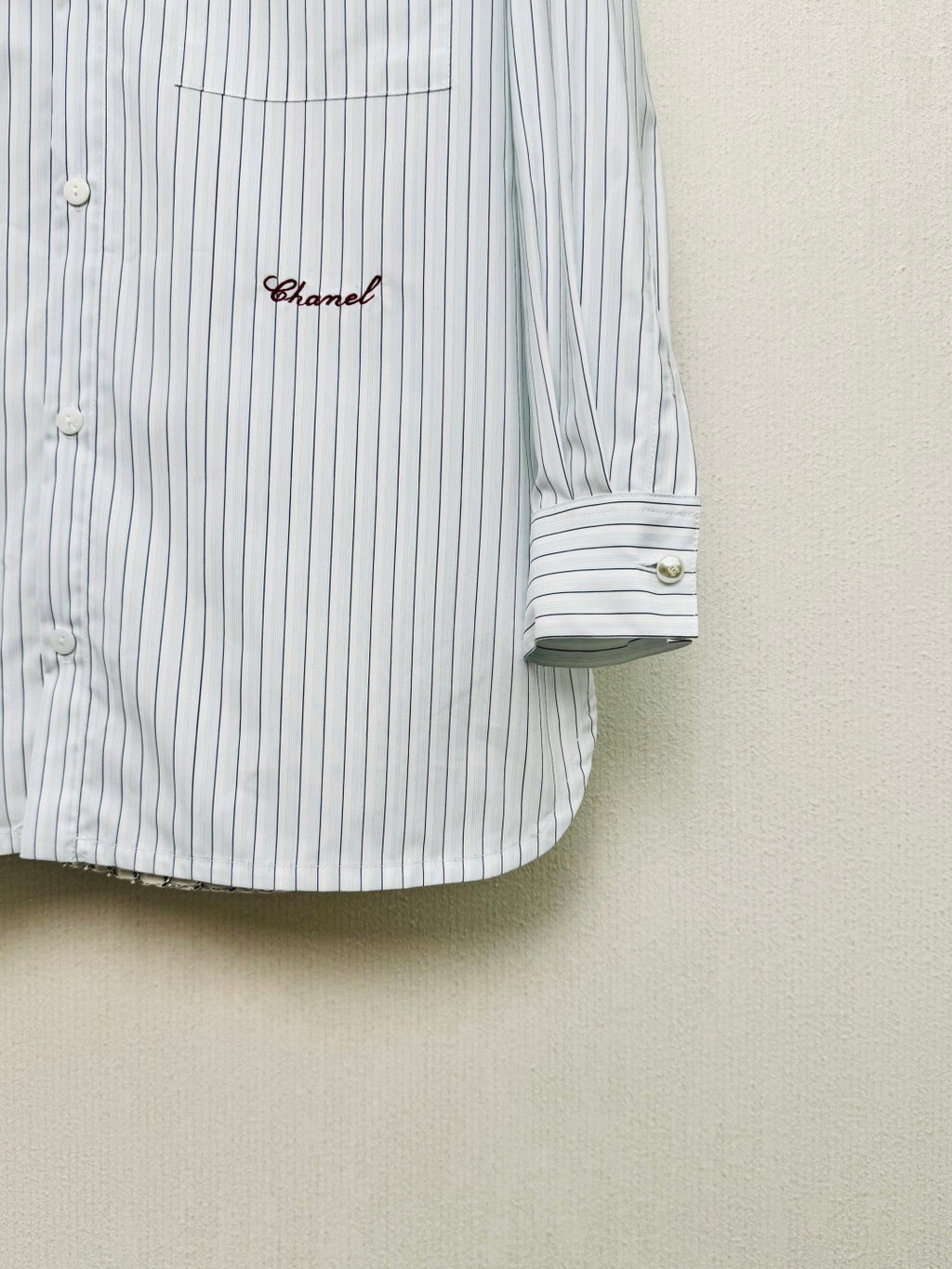 Striped shirt from the Spring/Summer 2026 collection, featuring a blue and white vertical stripe design, fresh and simple.