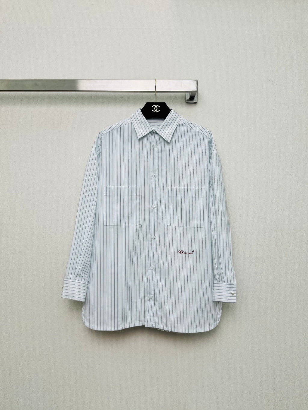 Striped shirt from the Spring/Summer 2026 collection, featuring a blue and white vertical stripe design, fresh and simple.