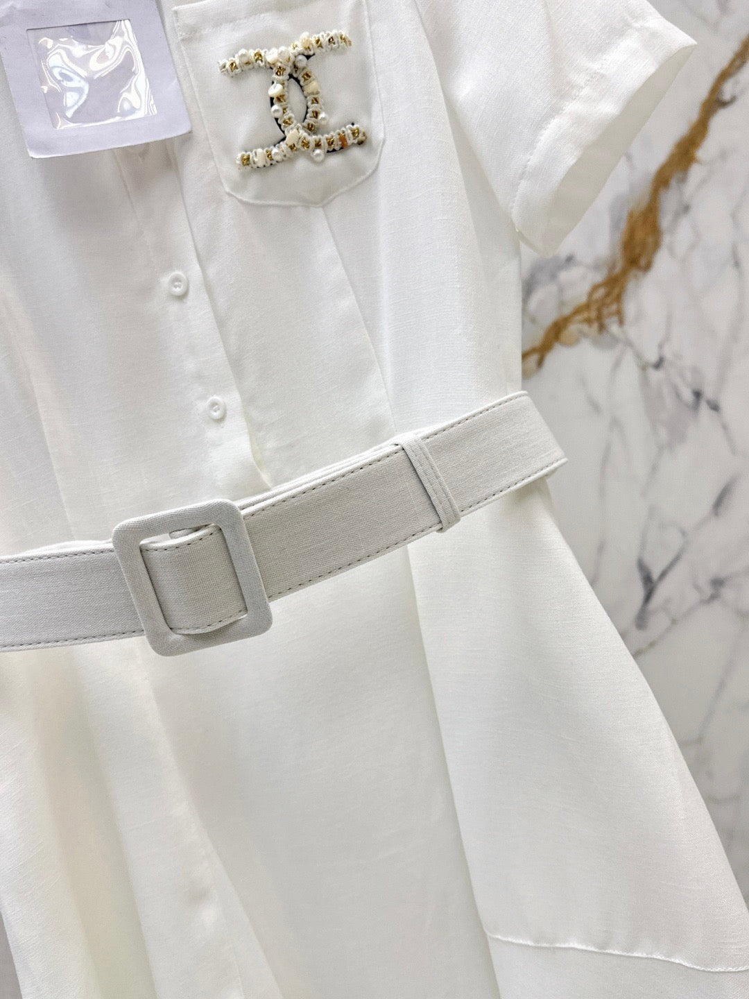26SS — Latest Spring/Summer Collection: Long Dress with Beaded Pocket Embellishment 🤍 Features pearls at the pockets alongside a woven metal Double-C logo.