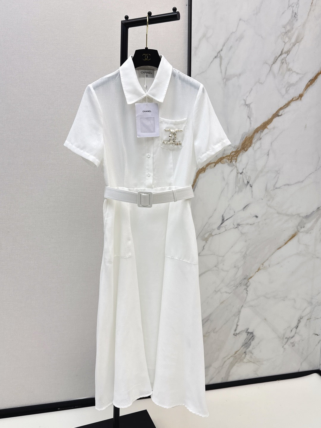 26SS — Latest Spring/Summer Collection: Long Dress with Beaded Pocket Embellishment 🤍 Features pearls at the pockets alongside a woven metal Double-C logo.