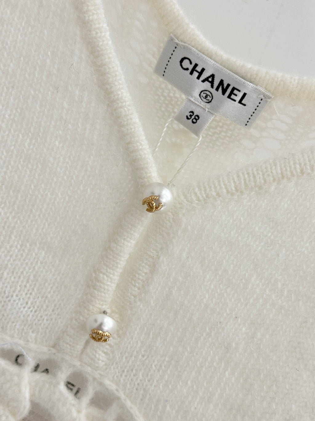Spring/Summer '26 New Arrival: A Chanel-style open-knit vest, delicately adorned with pearls—an exquisite and versatile wardrobe staple.