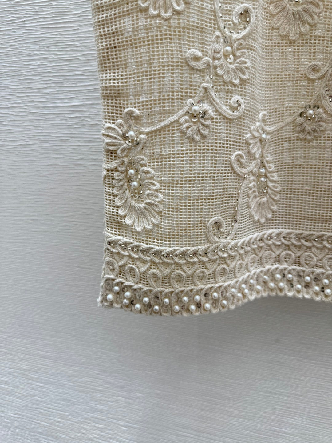 2026 New Arrival: Sleeveless V-Neck Knit Top in Apricot — Featuring Openwork Logo Pattern, Pearl Embroidery, and Single-Breasted Design