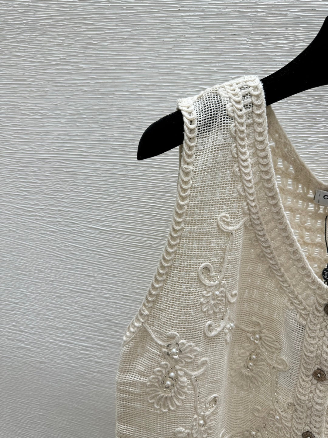 2026 New Arrival: Sleeveless V-Neck Knit Top in Apricot — Featuring Openwork Logo Pattern, Pearl Embroidery, and Single-Breasted Design