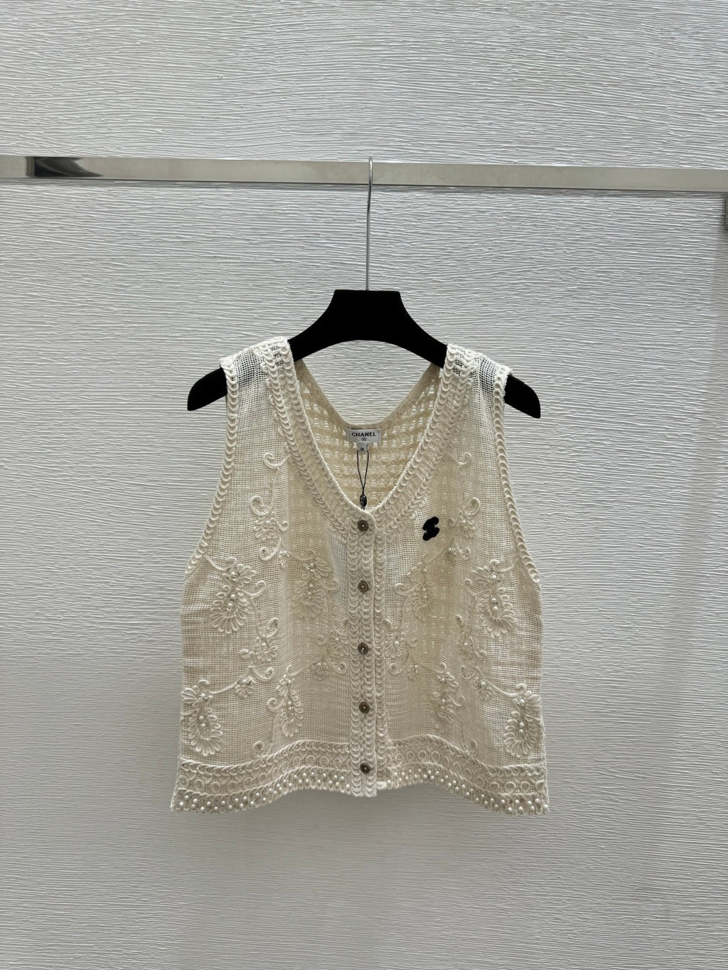 2026 New Arrival: Sleeveless V-Neck Knit Top in Apricot — Featuring Openwork Logo Pattern, Pearl Embroidery, and Single-Breasted Design