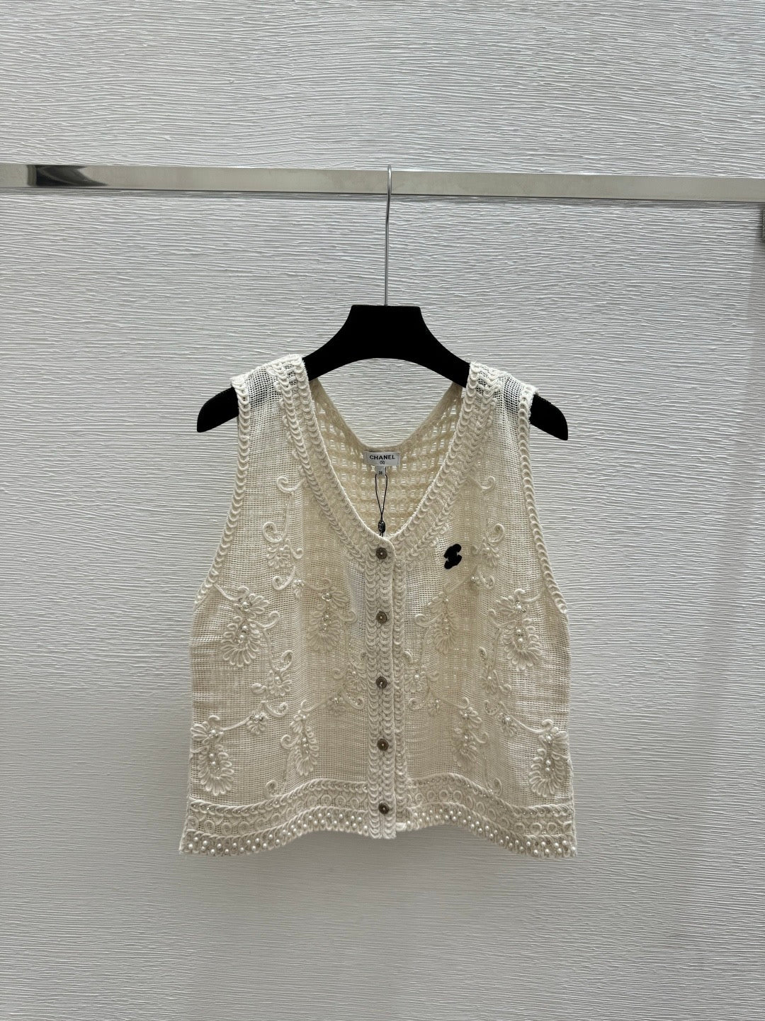 2026 New Arrival: Sleeveless V-Neck Knit Top in Apricot — Featuring Openwork Logo Pattern, Pearl Embroidery, and Single-Breasted Design