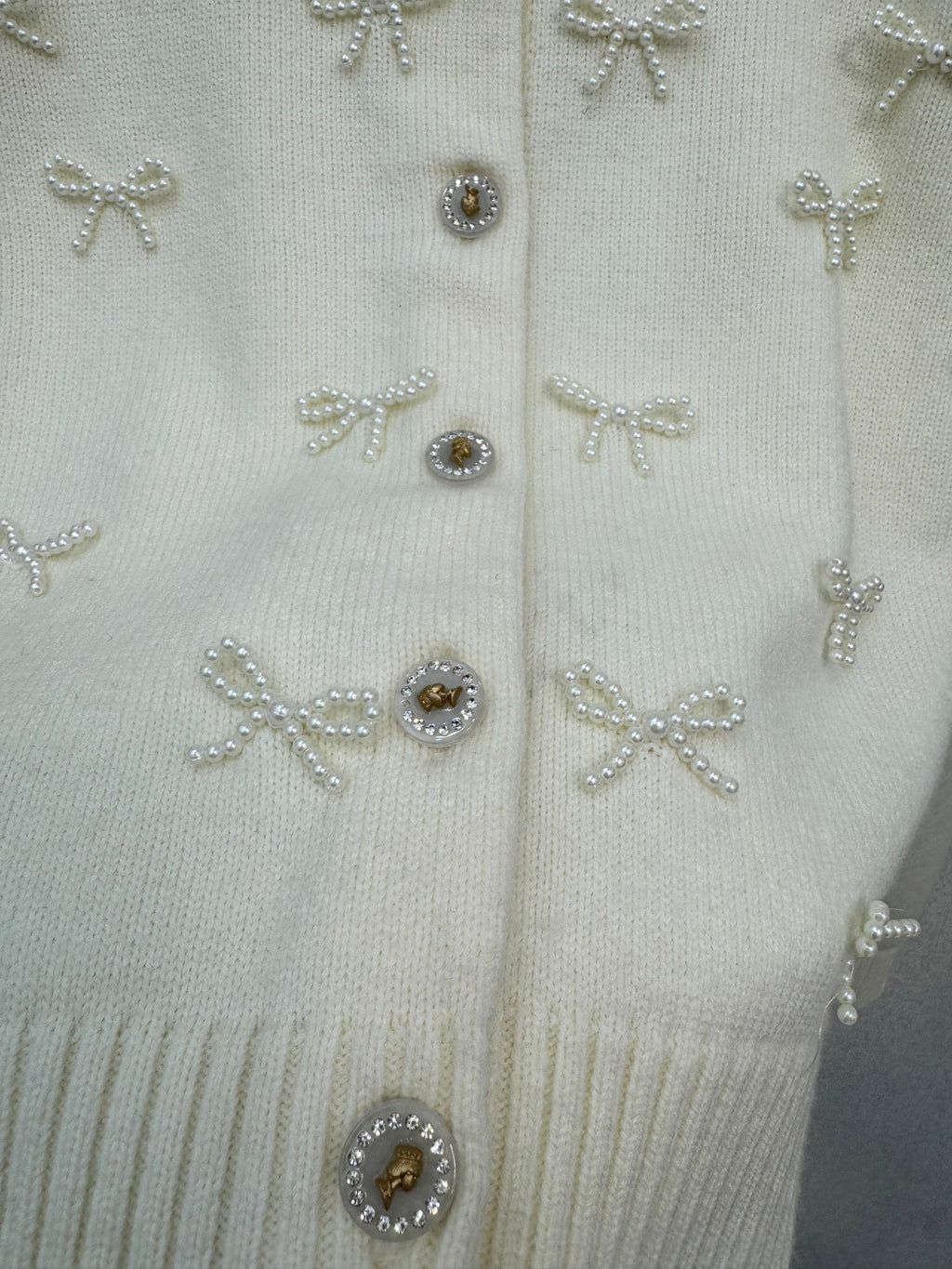 2026 New Arrival: Handcrafted Pearl & Bow-Knot Knitted Cardigan — Featuring Purely Hand-Beaded Bow-Knot Embellishments and Diamond-Style Buttons.