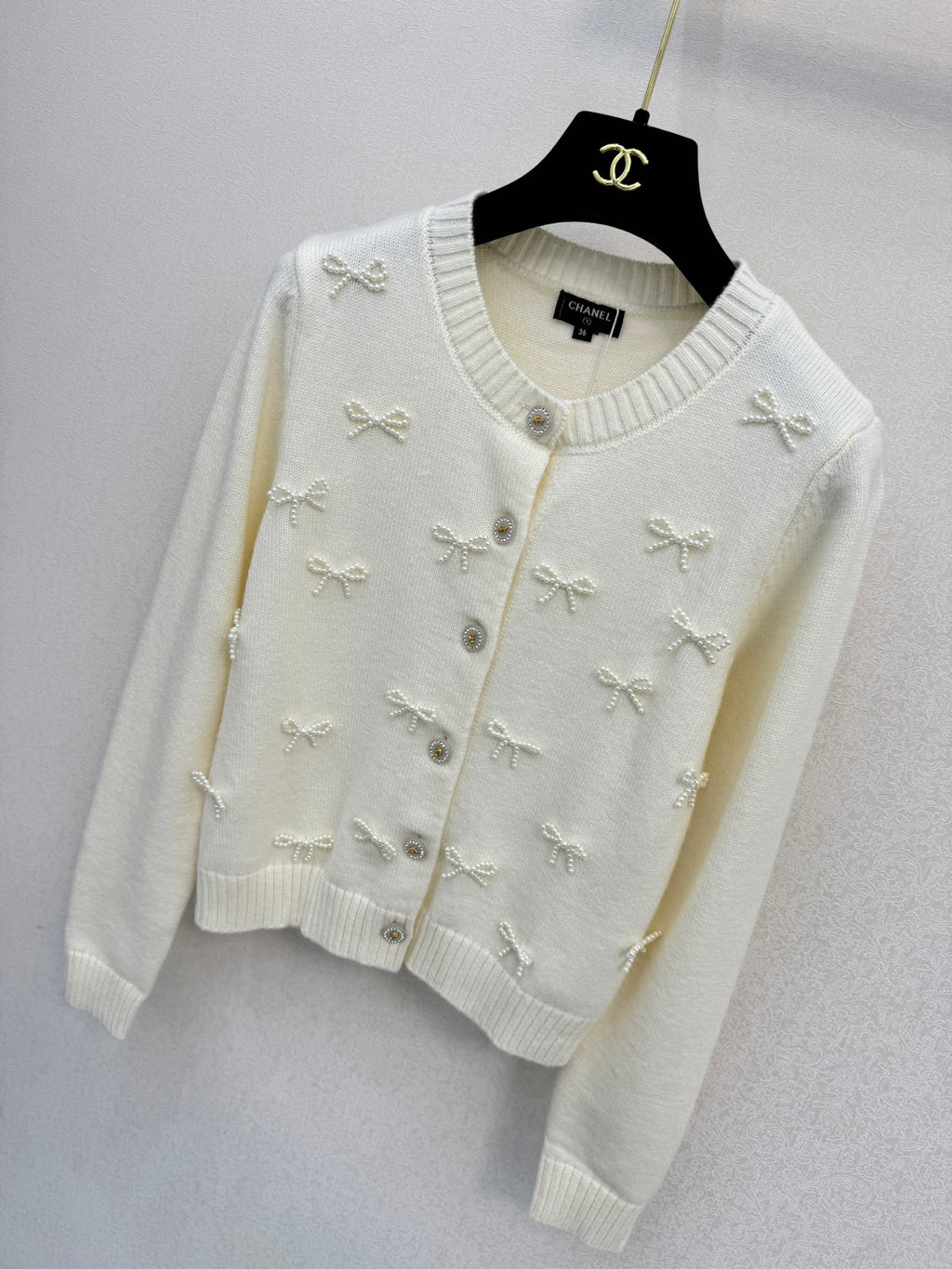 2026 New Arrival: Handcrafted Pearl & Bow-Knot Knitted Cardigan — Featuring Purely Hand-Beaded Bow-Knot Embellishments and Diamond-Style Buttons.