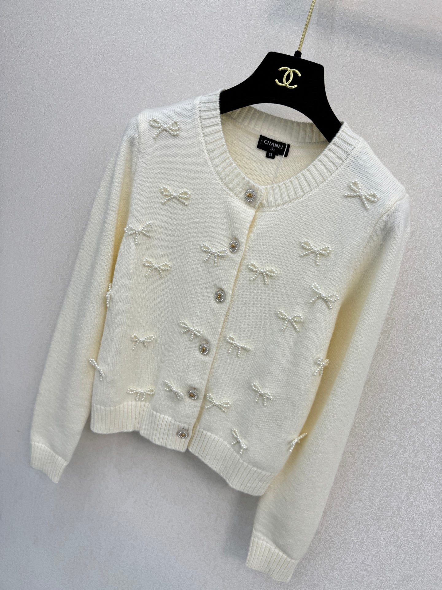 2026 New Arrival: Handcrafted Pearl & Bow-Knot Knitted Cardigan — Featuring Purely Hand-Beaded Bow-Knot Embellishments and Diamond-Style Buttons.