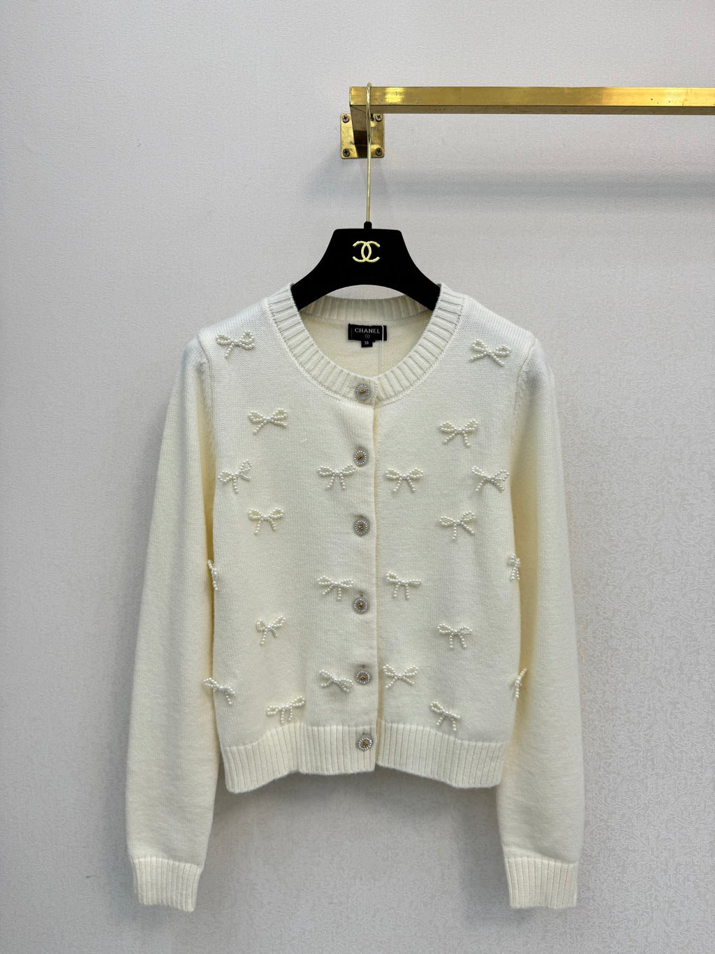 2026 New Arrival: Handcrafted Pearl & Bow-Knot Knitted Cardigan — Featuring Purely Hand-Beaded Bow-Knot Embellishments and Diamond-Style Buttons.