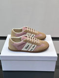 Classic low-top sneakers, featuring a combination of leather and suede.